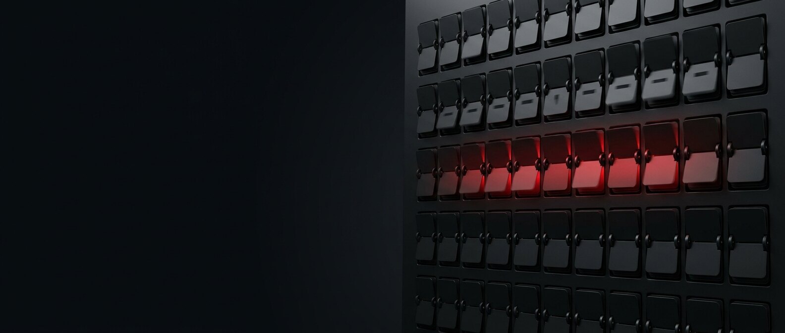 Mechanical split-flap departure board with a single row of flaps illuminated red